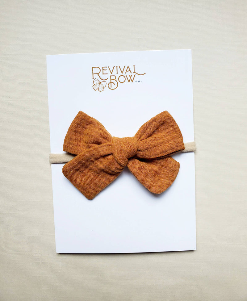 Classic Fabric Bow on Nylon Headband • Marigold